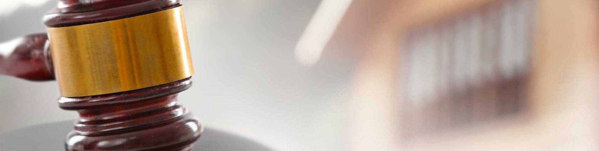 gavel with home in the background